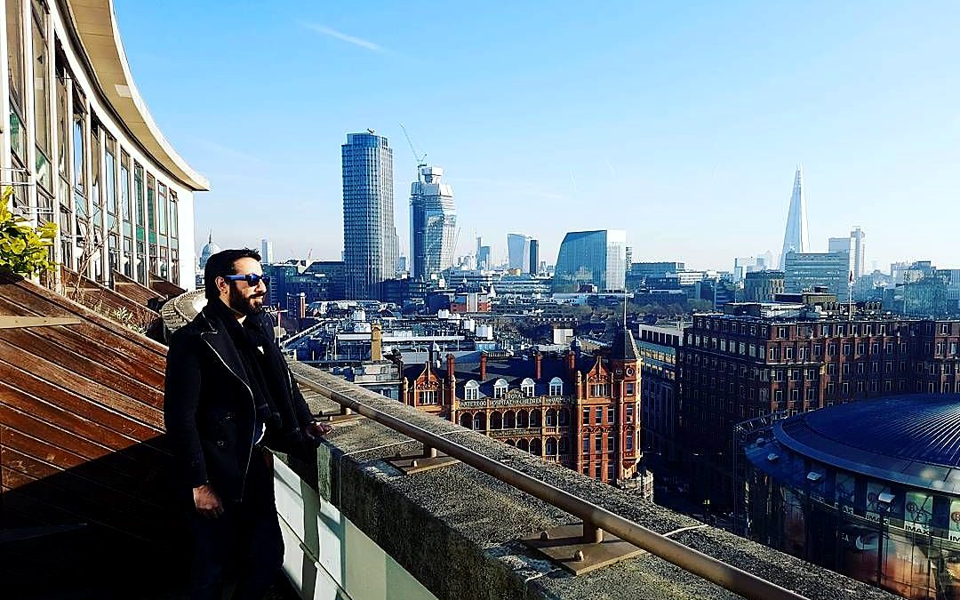 Kaiser Khan on a terrace overlooking the London skyline