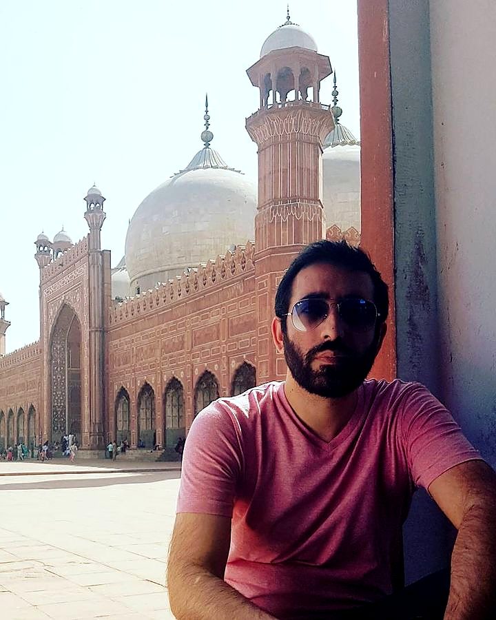 Kaiser Khan in the courtyard of a historic mosque in Pakistan